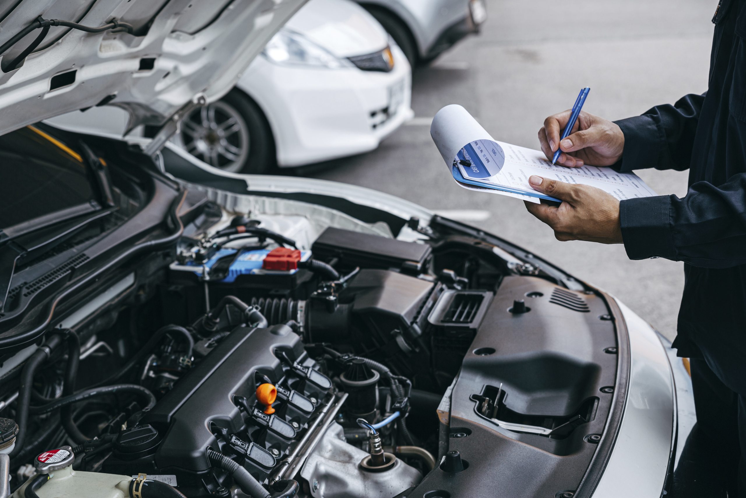 Mechanic check list to the clipboard insurance with inspecting c